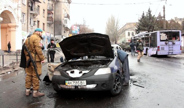On a scene in Leninsky district of Donetsk where there was an attack of a stop of public transport (A screenshot from video Ruptly) On a scene in Leninsky district of Donetsk where there was an attack of a stop of public transport (A screenshot from video Ruptly) - Sputnik International