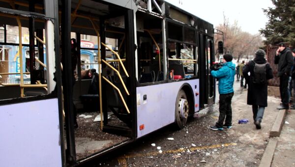 The bus fired at a stop of public transport in Leninsky district of Donetsk - Sputnik International