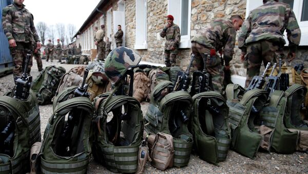 French soldiers prepare their equipment at the Satory military base, near Paris, as part of the highest level of Vigipirate security plan after last week's Islamic militants attacks January 13, 2015 - Sputnik International