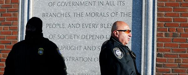 Police officers stand outside the federal courthouse in Boston for the first day of jury selection in the trial of Boston Marathon bombing suspect Dzhokhar Tsarnaev - Sputnik International