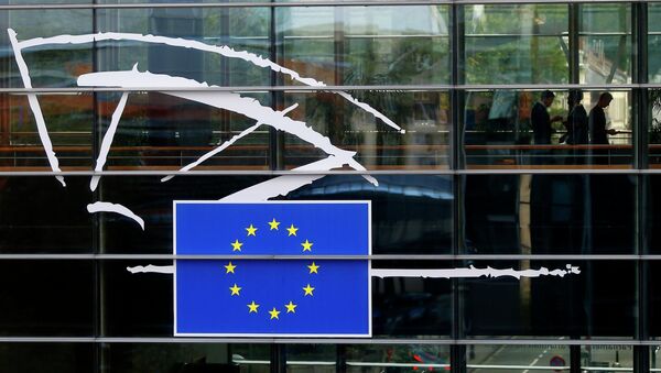 People are pictured through a window at the European Parliament in Brussels - Sputnik International