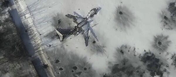 Airplane in the snow at the Sergey Prokofiev International Airport damaged by shelling during fighting Airplane in the snow at the Sergey Prokofiev International Airport damaged by shelling during fighting - Sputnik International
