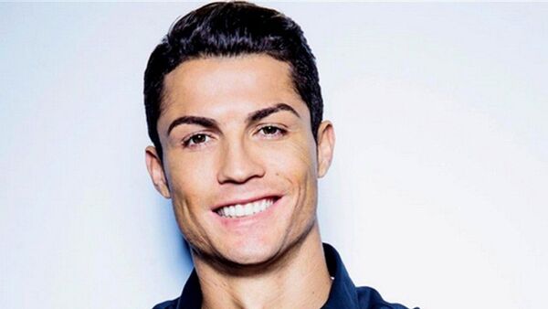 Portuguese Real Madrid footballer Cristiano Ronaldo poses for his new collection of CR7 Shirts - Sputnik International
