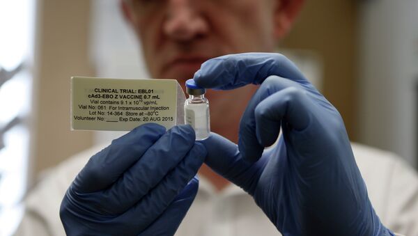 Professor Adrian Hill, director of the Jenner Institute and chief investigator of the trials with the Ebola vaccine Chimp Adenovirus type 3 (ChAd3), holds a vial of the vaccine - Sputnik International
