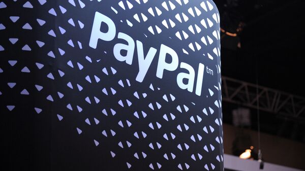 The logo of online payment company PayPal is pictured during LeWeb 2013 event in Saint-Denis near Paris on December 10, 2013 - Sputnik International