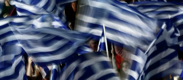 Supporters of Greece's Prime Minister Antonis Samaras wave Greek flags Supporters of Greece's Prime Minister Antonis Samaras wave Greek flags - Sputnik International