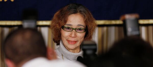 Junko Ishido, mother of Kenji Goto, a Japanese journalist being held captive by Islamic State militants along with another Japanese citizen, is surrounded by photographers as she attends a news conference at the Foreign Correspondents' Club of Japan in Tokyo January 23, 2015 Junko Ishido, mother of Kenji Goto, a Japanese journalist being held captive by Islamic State militants along with another Japanese citizen, is surrounded by photographers as she attends a news conference at the Foreign Correspondents' Club of Japan in Tokyo January 23, 2015 - Sputnik International