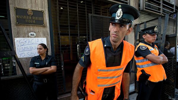 Police officers stand guard outside the prosecutor's office that leads the investigation into the death of Alberto Nisman, a prosecutor found dead in his apartment, in Buenos Aires, Argentina, Friday, Jan. 23, 2015 - Sputnik International