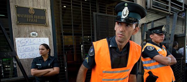 Police officers stand guard outside the prosecutor's office that leads the investigation into the death of Alberto Nisman, a prosecutor found dead in his apartment, in Buenos Aires, Argentina, Friday, Jan. 23, 2015 - Sputnik International