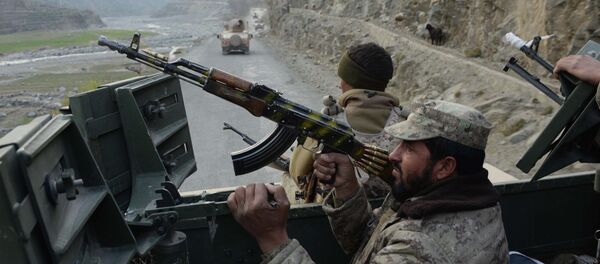 Afghan security personnel patrol during an ongoing anti-Taliban operation in Dangam district near the Pakistan-Afghanistan border in the eastern Kunar province - Sputnik International