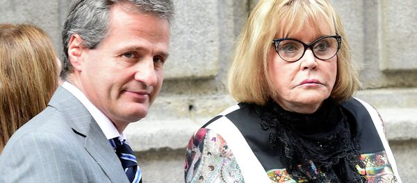 Argentine federal judge Maria Servini de Cubria (R) and prosecutor federal Ramiro Gonzalez (L) leave the courthouse in Madrid on May 29, 2014 Argentine federal judge Maria Servini de Cubria (R) and prosecutor federal Ramiro Gonzalez (L) leave the courthouse in Madrid on May 29, 2014 - Sputnik International
