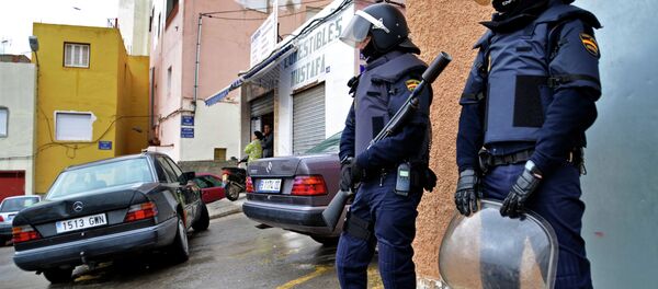 Policemen take part to an operation against a jihadist cell in the Spanish city of Melilla on March 14, 2014 Policemen take part to an operation against a jihadist cell in the Spanish city of Melilla on March 14, 2014 - Sputnik International