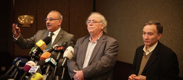 Syrian actor Jamal Suleiman (L), member of the National Coalition Fayez Sarah (C) and member of the regime-tolerated domestic National Coordination Committee for Democratic Change, Haytham Manna, attend a press conference held by various Syrian opposition factions on January 24, 2015 in the Egyptian capital Cairo Syrian actor Jamal Suleiman (L), member of the National Coalition Fayez Sarah (C) and member of the regime-tolerated domestic National Coordination Committee for Democratic Change, Haytham Manna, attend a press conference held by various Syrian opposition factions on January 24, 2015 in the Egyptian capital Cairo - Sputnik International