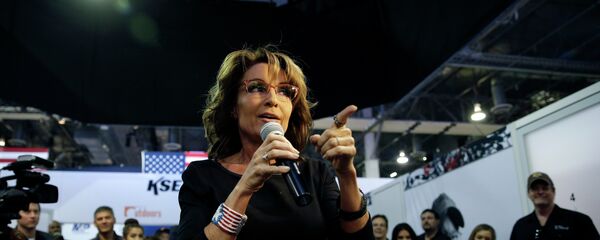 Former Alaska Gov. Sarah Palin speaks to a crowd during an event to promote her television show, Amazing America with Sarah Palin, at the Shooting, Hunting and Outdoor Trade Show, Thursday, Jan. 22, 2015, in Las Vegas Former Alaska Gov. Sarah Palin speaks to a crowd during an event to promote her television show, Amazing America with Sarah Palin, at the Shooting, Hunting and Outdoor Trade Show, Thursday, Jan. 22, 2015, in Las Vegas - Sputnik International