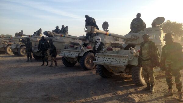 Soldiers of the Chadian army stand next to Panhard AML 90 armoured vehicles on January 21, 2015, at the border between Nigeria and Cameroon - Sputnik International