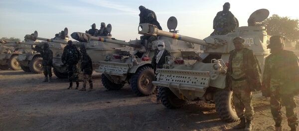 Soldiers of the Chadian army stand next to Panhard AML 90 armoured vehicles on January 21, 2015, at the border between Nigeria and Cameroon Soldiers of the Chadian army stand next to Panhard AML 90 armoured vehicles on January 21, 2015, at the border between Nigeria and Cameroon - Sputnik International