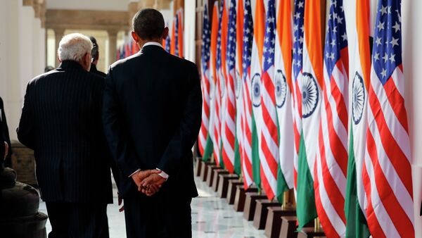 India's Prime Minister Narendra Modi and US President Barack Obama talk as they walk through Hyderabad House in New Delhi January 25, 2015 - Sputnik International