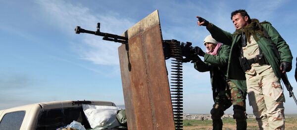 Kurdish Peshmerga fighters keep watch during the battle with Islamic State militants on the outskirts of Mosul January 21, 2015 - Sputnik International