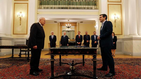 Head of radical leftist Syriza party and winner of the Greek parliamentary elections Alexis Tsipras (R) stands in front of Greek President Karolos Papoulias in the Presidential Palace in Athens during a swearing in ceremony as Greece's first leftist Prime Minister - Sputnik International