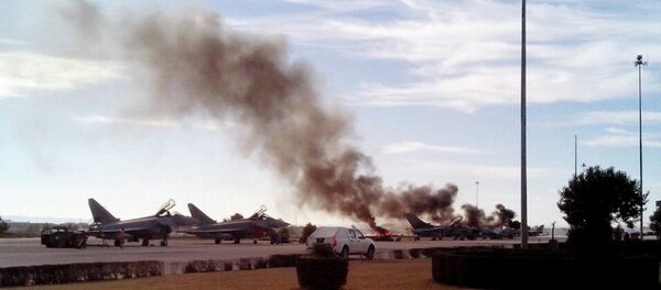 Smoke rises after a Greek F-16 fighter plane crashed during NATO training at the Albacete air base in Albacete January 26, 2015. Smoke rises after a Greek F-16 fighter plane crashed during NATO training at the Albacete air base in Albacete January 26, 2015. - Sputnik International
