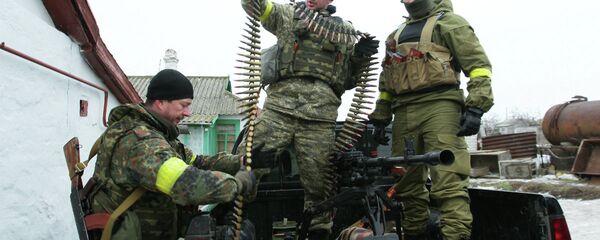 Ukrainian servicemen prepare their ammunition at a position on the frontline near the southern Ukrainian city of Mariupol on January 26, 2015. Ukrainian servicemen prepare their ammunition at a position on the frontline near the southern Ukrainian city of Mariupol on January 26, 2015. - Sputnik International