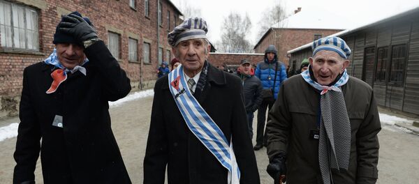 Former inmates of the Auschwitz-Birkenau concentration camp, during a memorial event marking the 70th anniversary of the camp's liberation, in Oswiecim Former inmates of the Auschwitz-Birkenau concentration camp, during a memorial event marking the 70th anniversary of the camp's liberation, in Oswiecim - Sputnik International