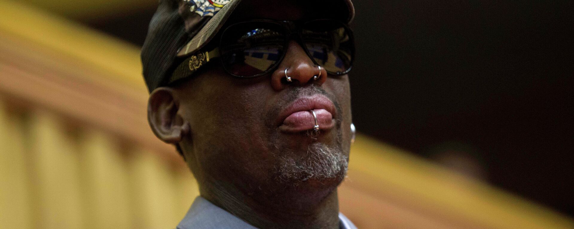 Dennis Rodman, looks out at the court at the end of an exhibition basketball game with U.S. and North Korean players at an indoor stadium in Pyongyang, North Korea - Sputnik International, 1920, 21.08.2022