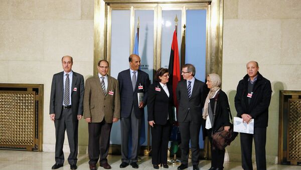 Special Representative of the U.N. Secretary-General for Libya and Head of United Nations Support Mission in Libya (UNSMIL) Bernardino Leon (3rd R) poses with Civil Society Representatives and former members of the National Transitional Council, for a group photograph after a news conference at the Palais des Nations in Geneva - Sputnik International