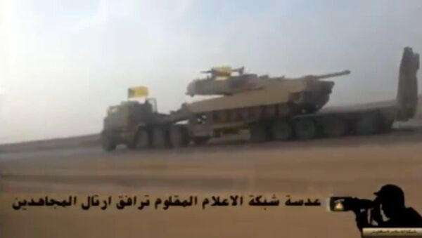 In this screenshot from a video uploaded to YouTube, a Hezbollah Brigades convoy transports an American-made M1 Abrams tank to the front lines of the battle with ISIL. - Sputnik International