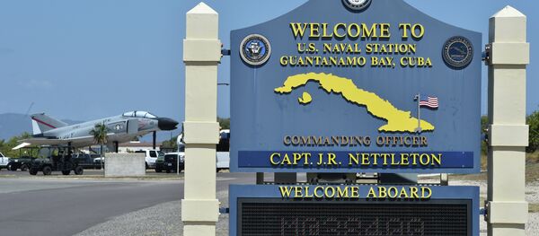 This photo reviewed by the US military and made during an escorted visit shows a welcome board at the road to the US Naval Station in Guantanamo Bay, Cuba This photo reviewed by the US military and made during an escorted visit shows a welcome board at the road to the US Naval Station in Guantanamo Bay, Cuba - Sputnik International