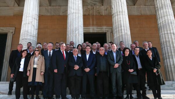 Greek Prime Minister Alexis Tsipras (front row C) and members of his government pose for a group picture after the first meeting of the new cabinet in the parliament building in Athens January 28, 2015. - Sputnik International