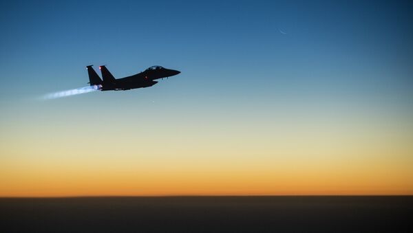 A US Air Force F-15E Strike Eagle aircraft flies over northern Iraq Sept. 23, 2014 - Sputnik International
