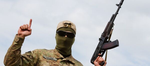Aidar soldier pose for picture showing the islamic sign of faith - Sputnik International