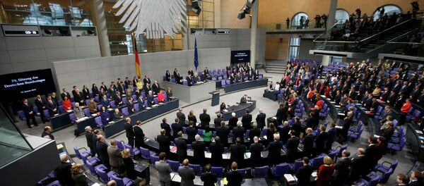 German Chancellor Angela Merkel, members of government and parliament observe a minute of silence to commemorate the victims of the attack at the Paris offices of French weekly satirical newspaper Charlie Hebdo - Sputnik International