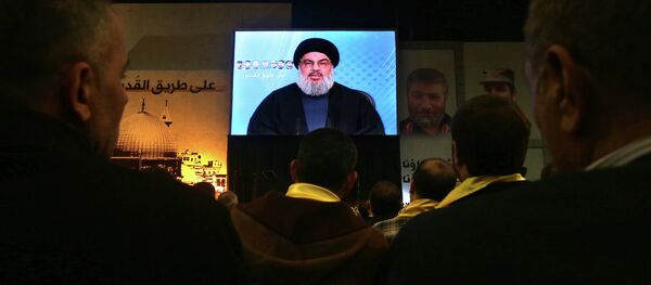 Hezbollah leader Sheikh Hassan Nasrallah, speaks via video link to his supporters Hezbollah leader Sheikh Hassan Nasrallah, speaks via video link to his supporters - Sputnik International