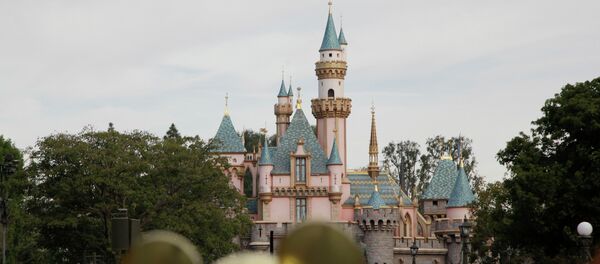 People walk toward the Sleeping Beauty's Castle in the background at Disneyland, Thursday, Jan. 22, 2015, in Anaheim, Calif - Sputnik International