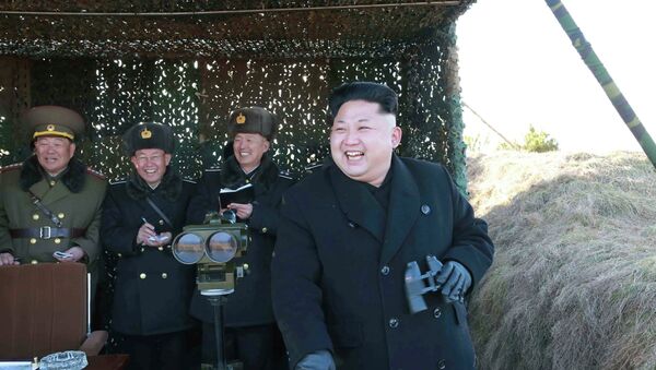 North Korean leader Kim Jong Un (R) laughs as he watches a drill by the Korean People's Army (KPA) for hitting enemy naval target at undisclosed location in this undated photo released by North Korea's Korean Central News Agency (KCNA) in Pyongyang January 31, 2015 - Sputnik International
