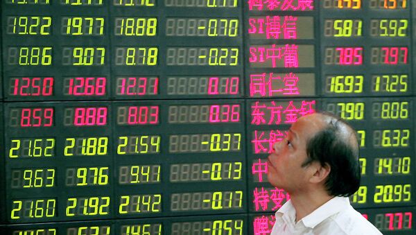 An investor looks at a stock price monitor at a private securities company  - Sputnik International