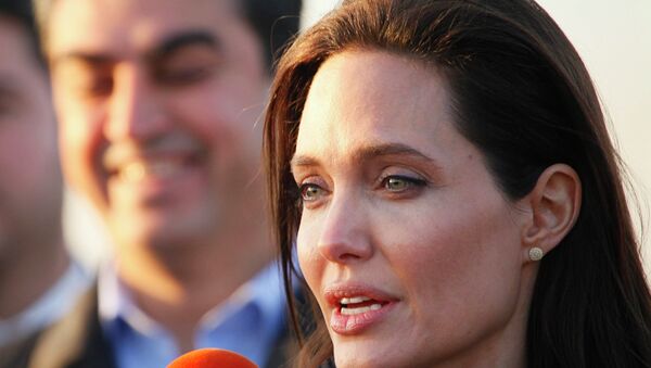 Actress and special envoy of the U.N. High Commissioner for Refugees (UNHCR) Angelina Jolie speaks to the media as she visits a Kurdish refugee camp in Dohuk, northern Iraq January 25, 2015 - Sputnik International