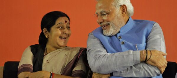 Opposition Bharatiya Janata Party (BJP) leader and India's next prime minister Narendra Modi, right, has a laugh with party leader Sushma Swaraj Opposition Bharatiya Janata Party (BJP) leader and India's next prime minister Narendra Modi, right, has a laugh with party leader Sushma Swaraj - Sputnik International
