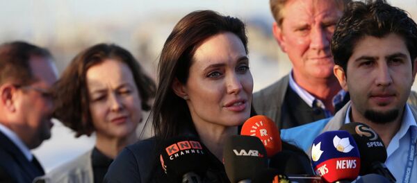 US actress and UNHCR ambassador Angelina Jolie delivers a speech during a visit to a camp for displaced Iraqis in Khanke US actress and UNHCR ambassador Angelina Jolie delivers a speech during a visit to a camp for displaced Iraqis in Khanke - Sputnik International
