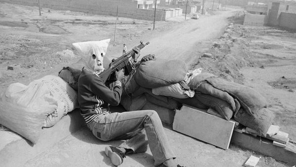 Hooded gunmen supporting Iran's central Islamic government, waiting on rooftop position in Khoramshahr, Iran on Friday, June 1, 1979 - Sputnik International