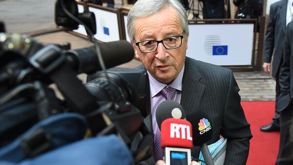 European Commission President Jean-Claude Juncker addresses reporters as he arrives to attend a Eurogroup finance ministers meeting at the European Council in Brussels, on January 26, 2015 - Sputnik International