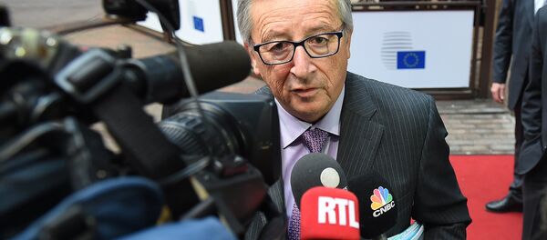 European Commission President Jean-Claude Juncker addresses reporters as he arrives to attend a Eurogroup finance ministers meeting at the European Council in Brussels, on January 26, 2015 - Sputnik International
