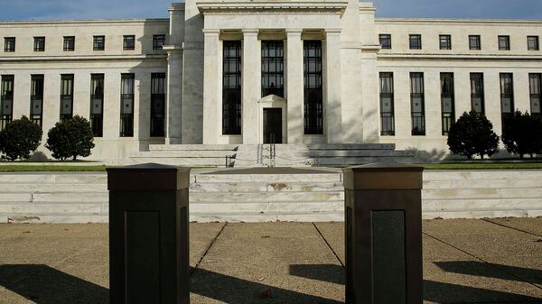 The United States Federal Reserve Board building is shown behind security barriers in Washington - Sputnik International