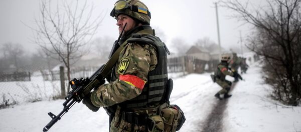File Photo: Ukrainian servicemen patrol Orekhovo village in Luhansk region January 28, 2015 File Photo: Ukrainian servicemen patrol Orekhovo village in Luhansk region January 28, 2015 - Sputnik International