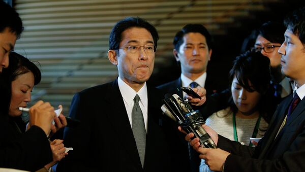 Japan's Foreign Minister Fumio Kishida listens to questions from reporters - Sputnik International