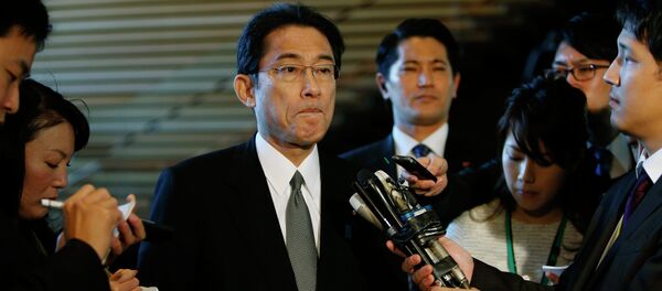 Japan's Foreign Minister Fumio Kishida listens to questions from reporters - Sputnik International