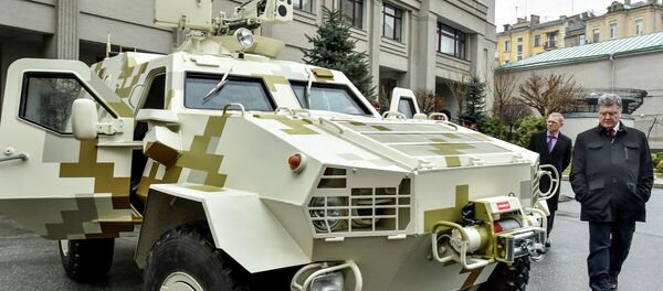 Ukraine's President Petro Poroshenko inspects an armoured vehicle in Kiev Ukraine's President Petro Poroshenko inspects an armoured vehicle in Kiev - Sputnik International