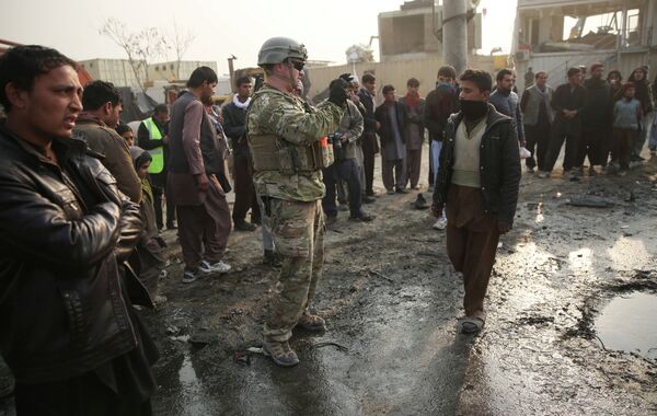 A US soldier at the site of a suicide car bomb attack in Kabul, Afghanistan. A US soldier at the site of a suicide car bomb attack in Kabul, Afghanistan. - Sputnik International